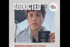 Young man holding a New Zealand passport with the word “ABDUCTED” written above, and “Samuel Leason NZ Citizen” below.